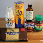 Ingredients for no-churn chocolate ice cream including heavy cream, chocolate, and sweetened condensed milk