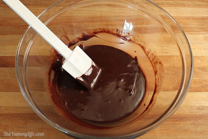 Melting chocolate mixture in a microwave-safe bowl for no-churn ice cream