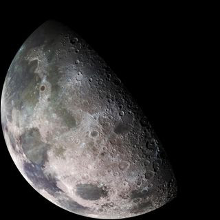 A detailed view of a partially illuminated lunar surface showing large craters.