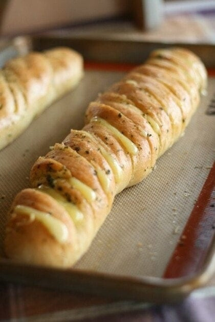 Buttery and cheesy Hasselback garlic bread with a golden-brown crust, perfect for serving alongside Chicken Parmesan