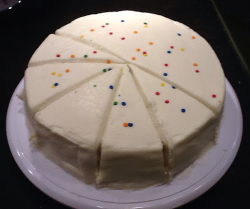 A beautifully decorated 9-inch cake, ready to be served, showcasing the perfect dessert for any occasion