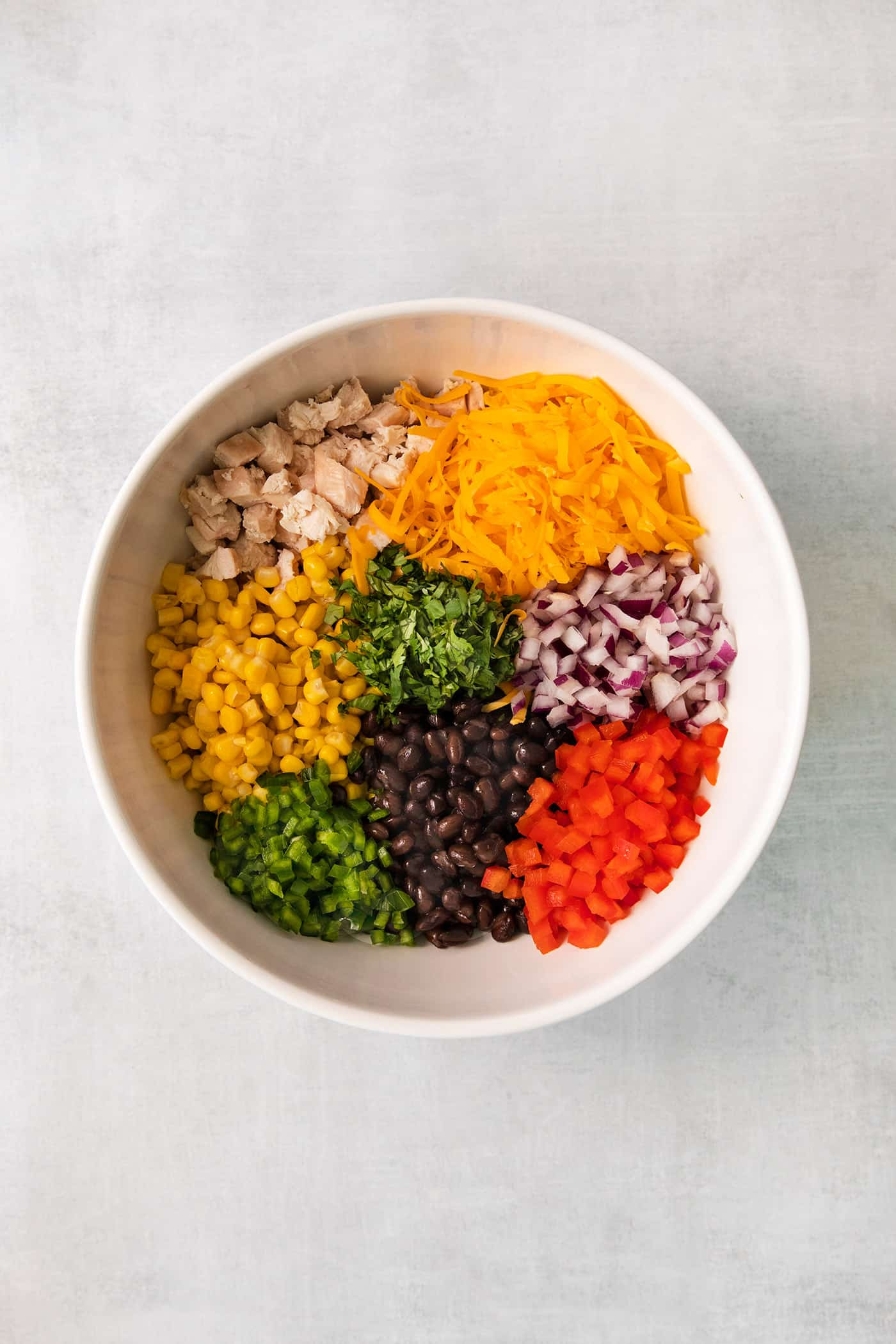 A spoonful of southwest chicken mixture, showcasing the ingredients and texture